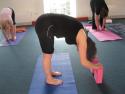 Student is using blocks to relax into Uttanasana